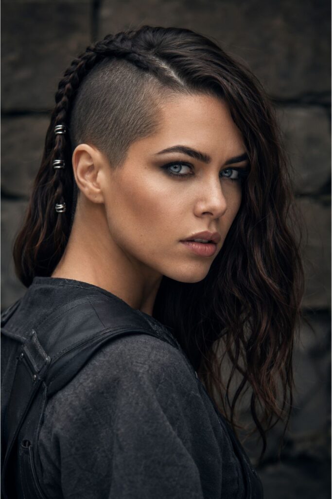 Woman with a half shaved warrior Viking style featuring a clean shaved side and textured longer section