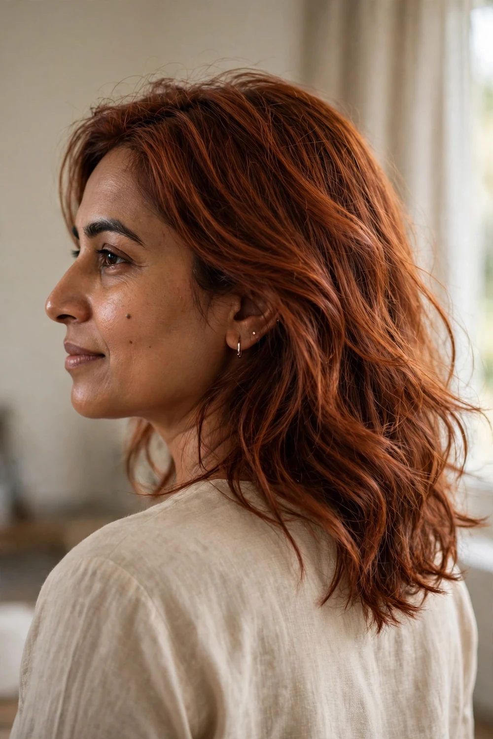 Woman with natural-looking auburn copper brown hair
