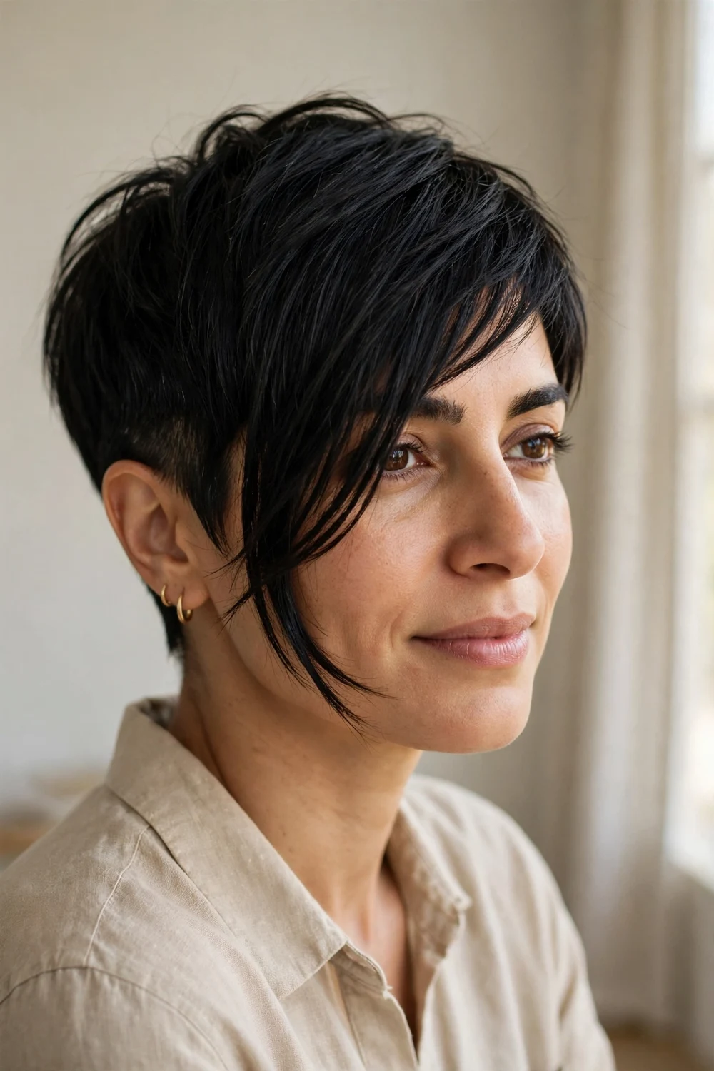 Asymmetrical pixie with one longer side and side-swept fringe