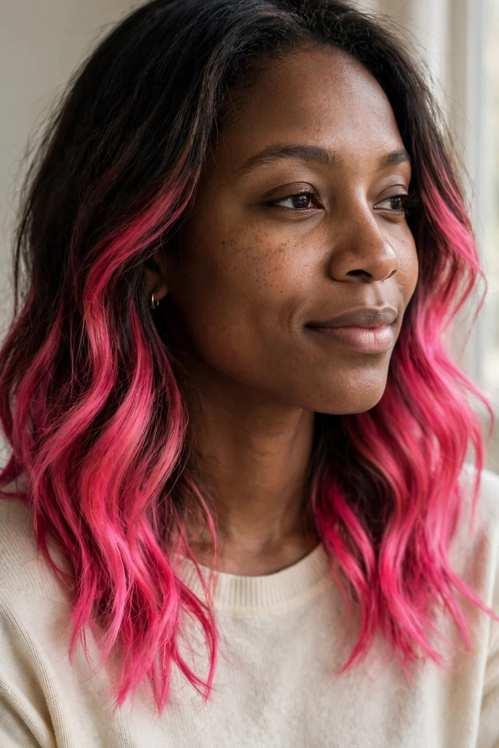 Hot pink balayage melting from dark medium-length hair