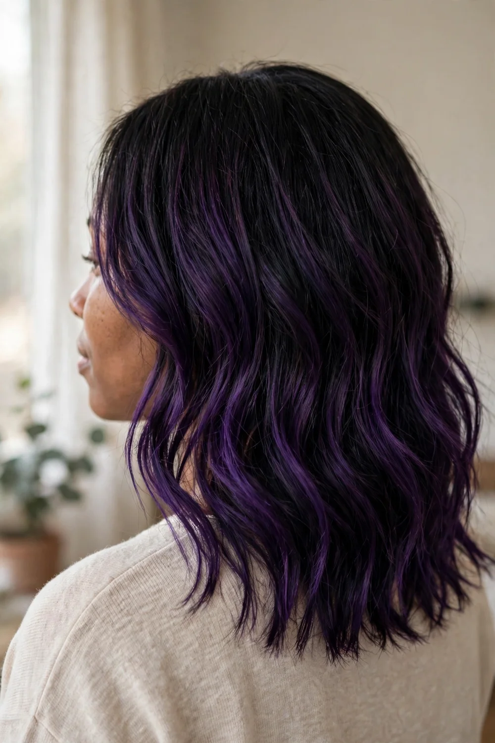 Dark violet balayage contrast on black medium-length hair