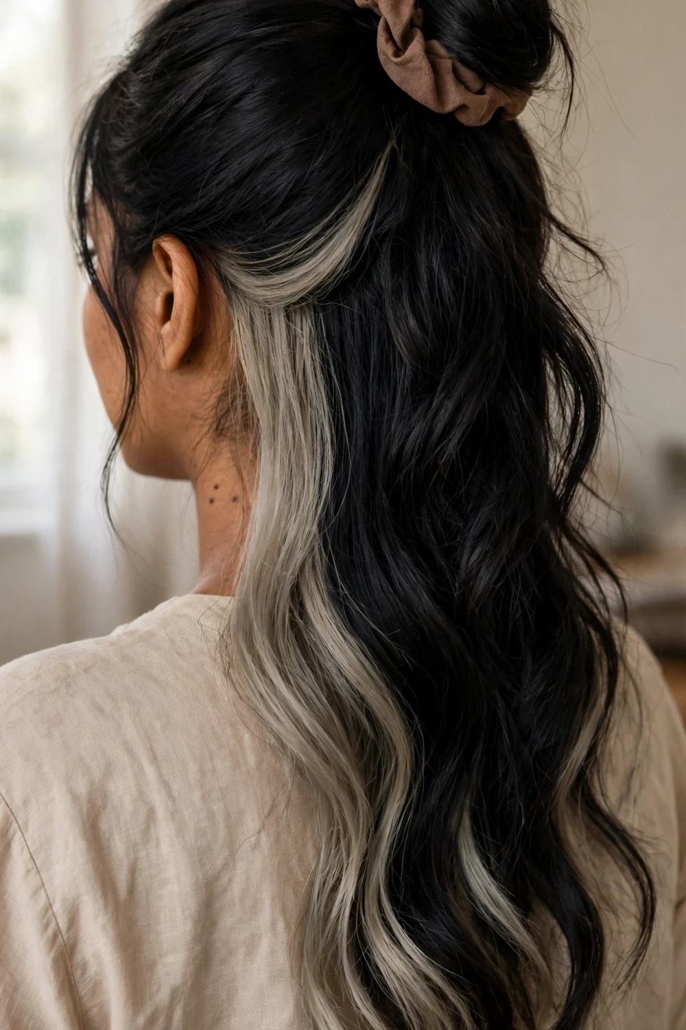 Peekaboo cool ash underlights under black hair