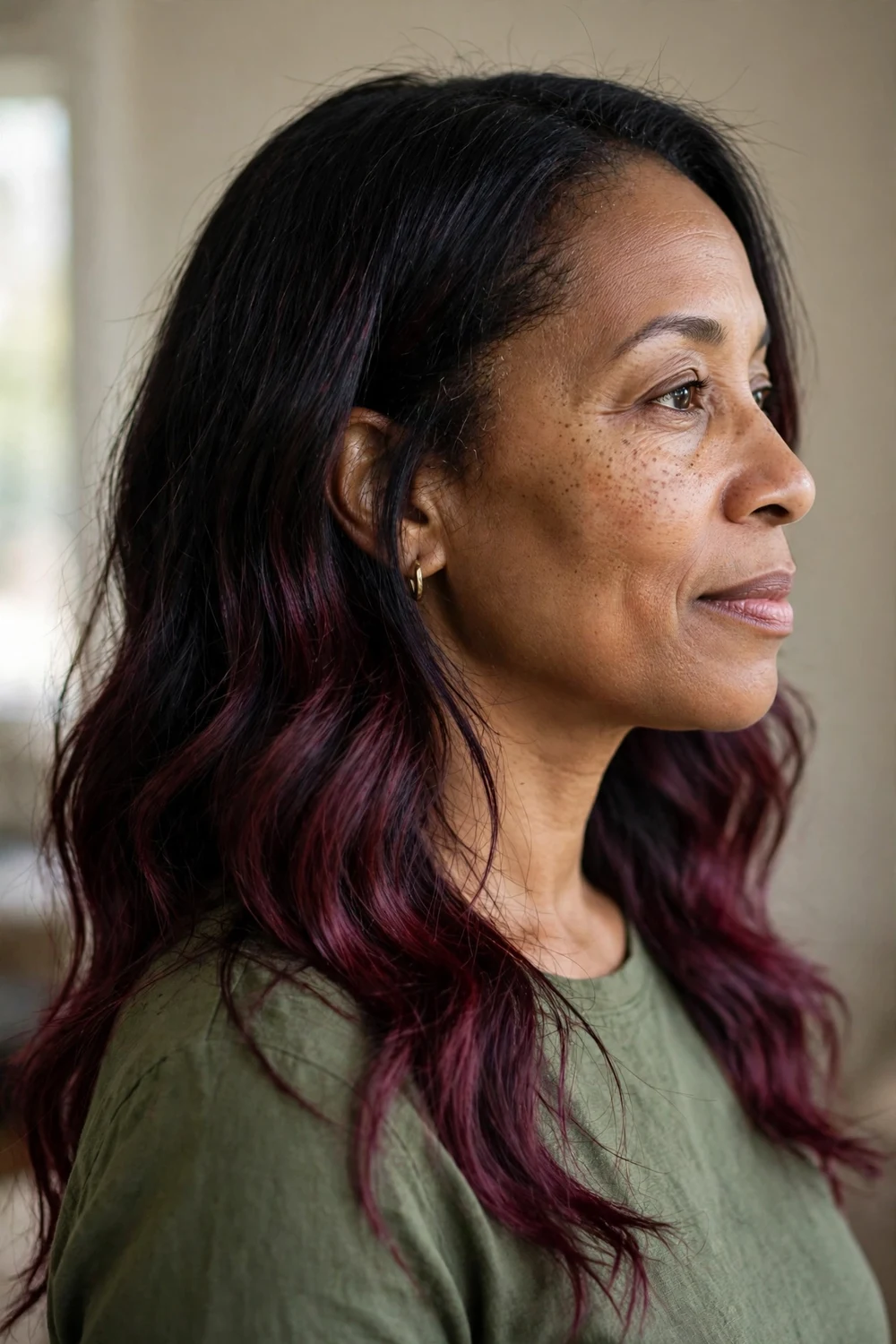 Woman with black to burgundy gradient hair