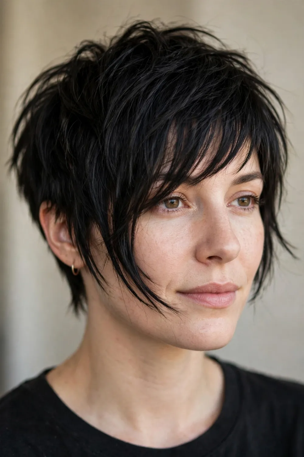 Choppy pixie with long side-swept bangs