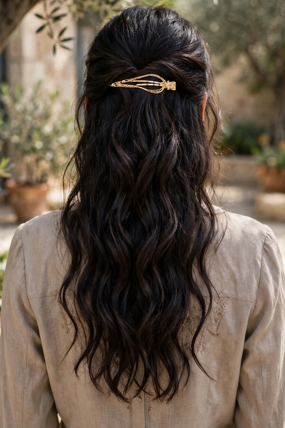 French barrette securing a half-up hairstyle elegantly