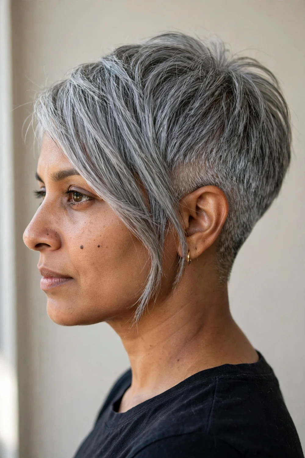 Angled bixie haircut with taper fade and longer front pieces