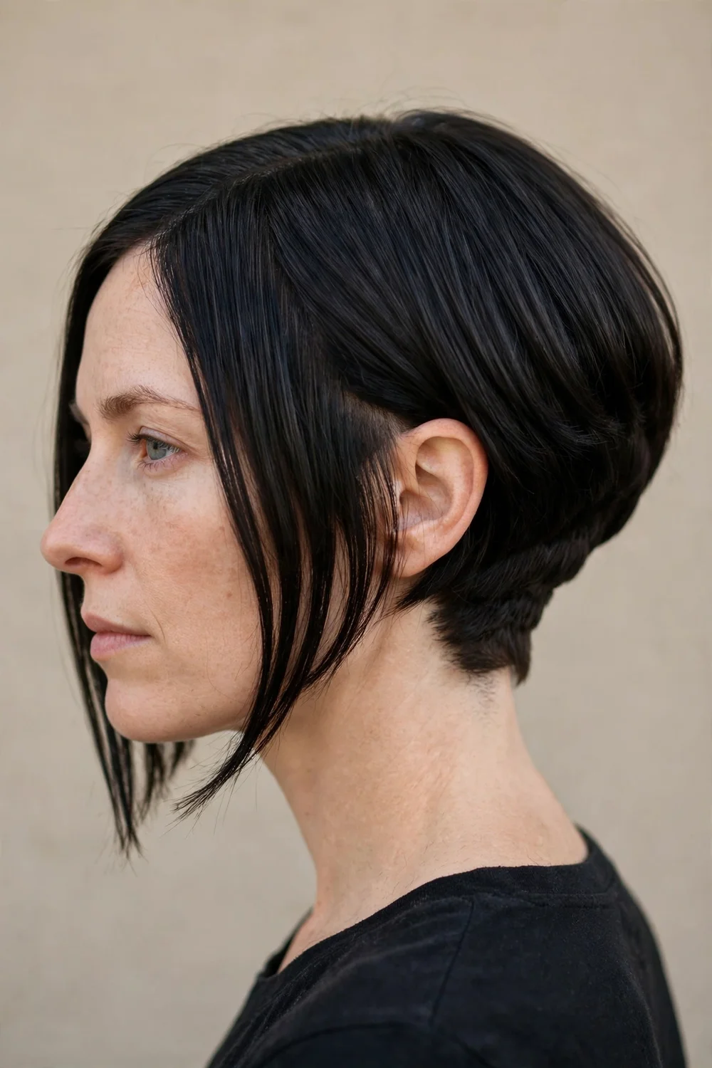 Inverted bob hiding a nape undercut under longer stacked layers