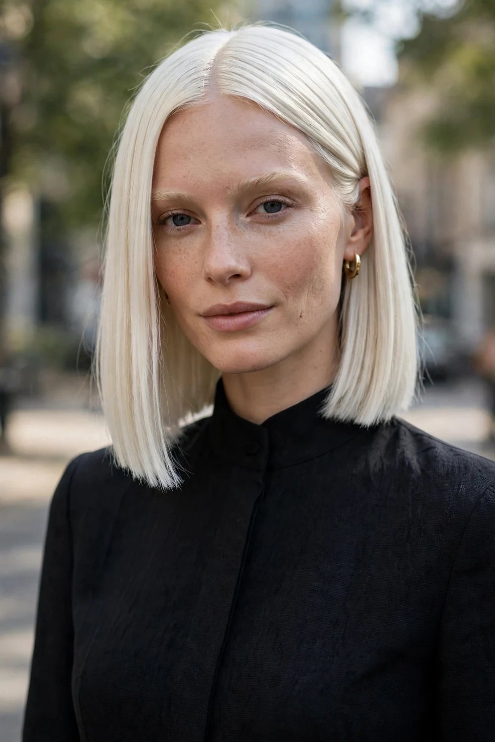 Platinum blonde long bob with a sharp blunt cut