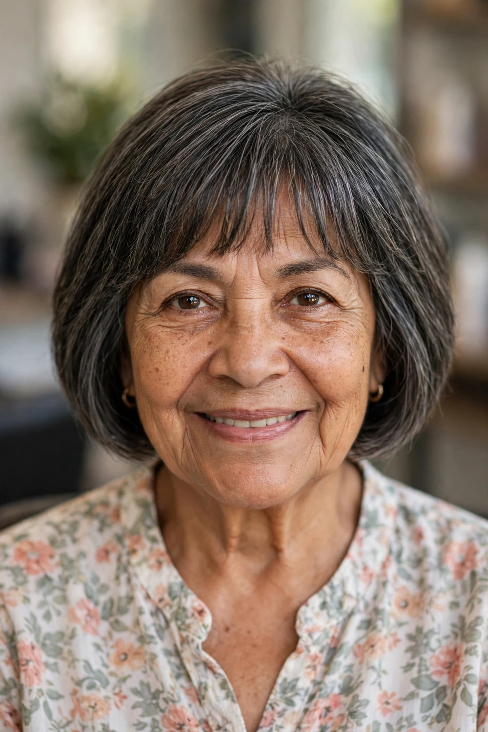 Mature woman with mini bob, bangs and layers