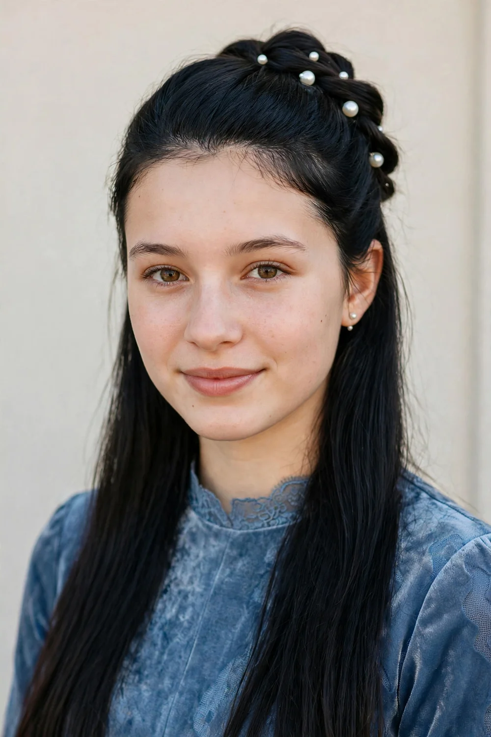 Half up prom hairstyle decorated with pearl pins