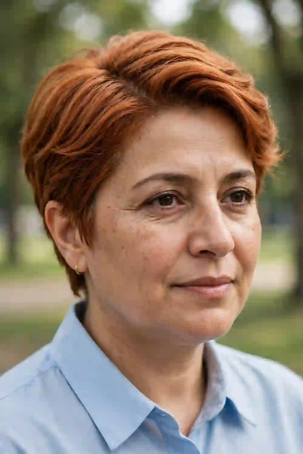 Woman with a round face wearing a textured crop with a side part
